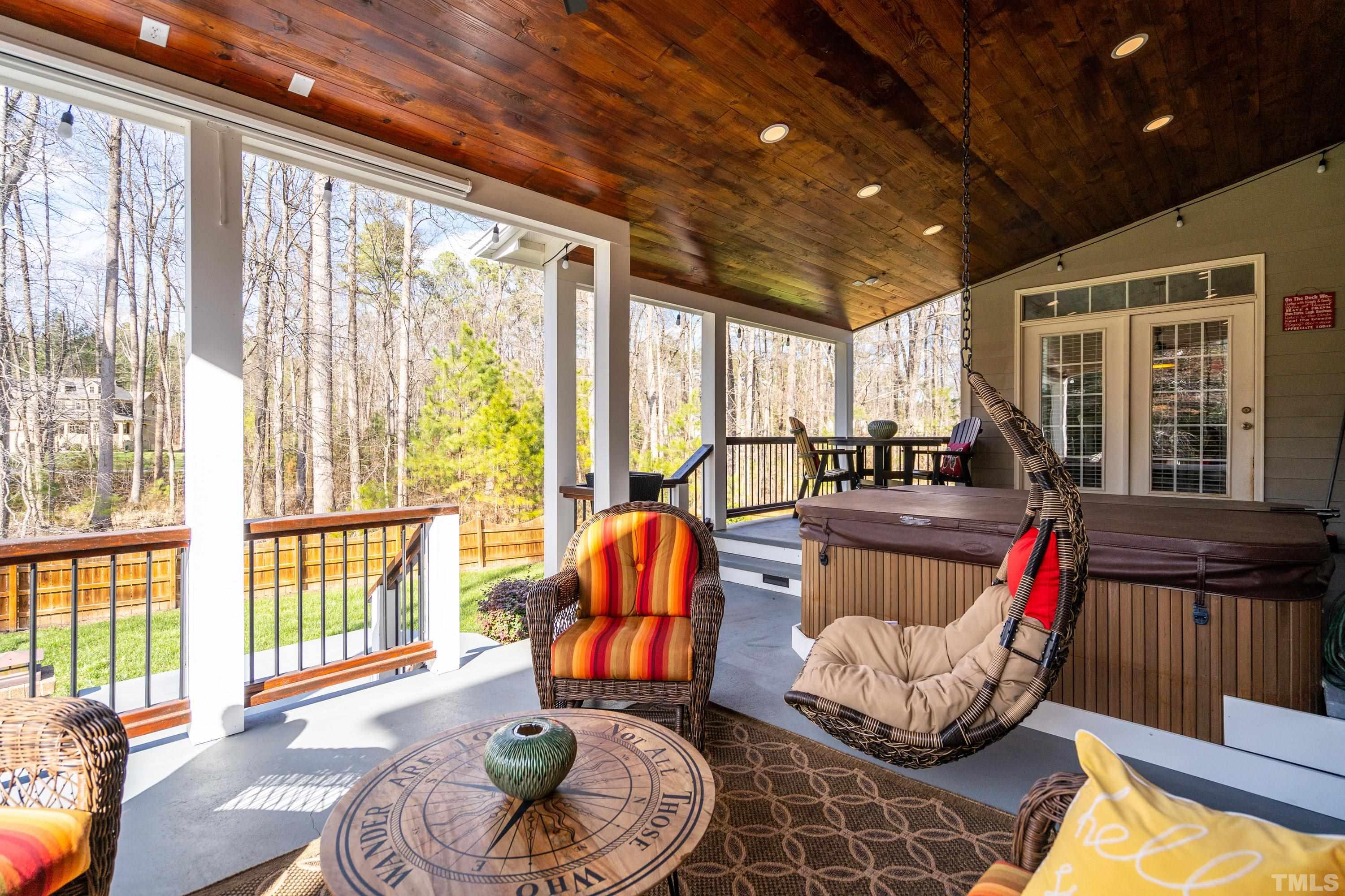 13016 Saxon Way Raleigh, NC 27613 - Photo 32 of 49 a living room with furniture and floor to ceiling windows