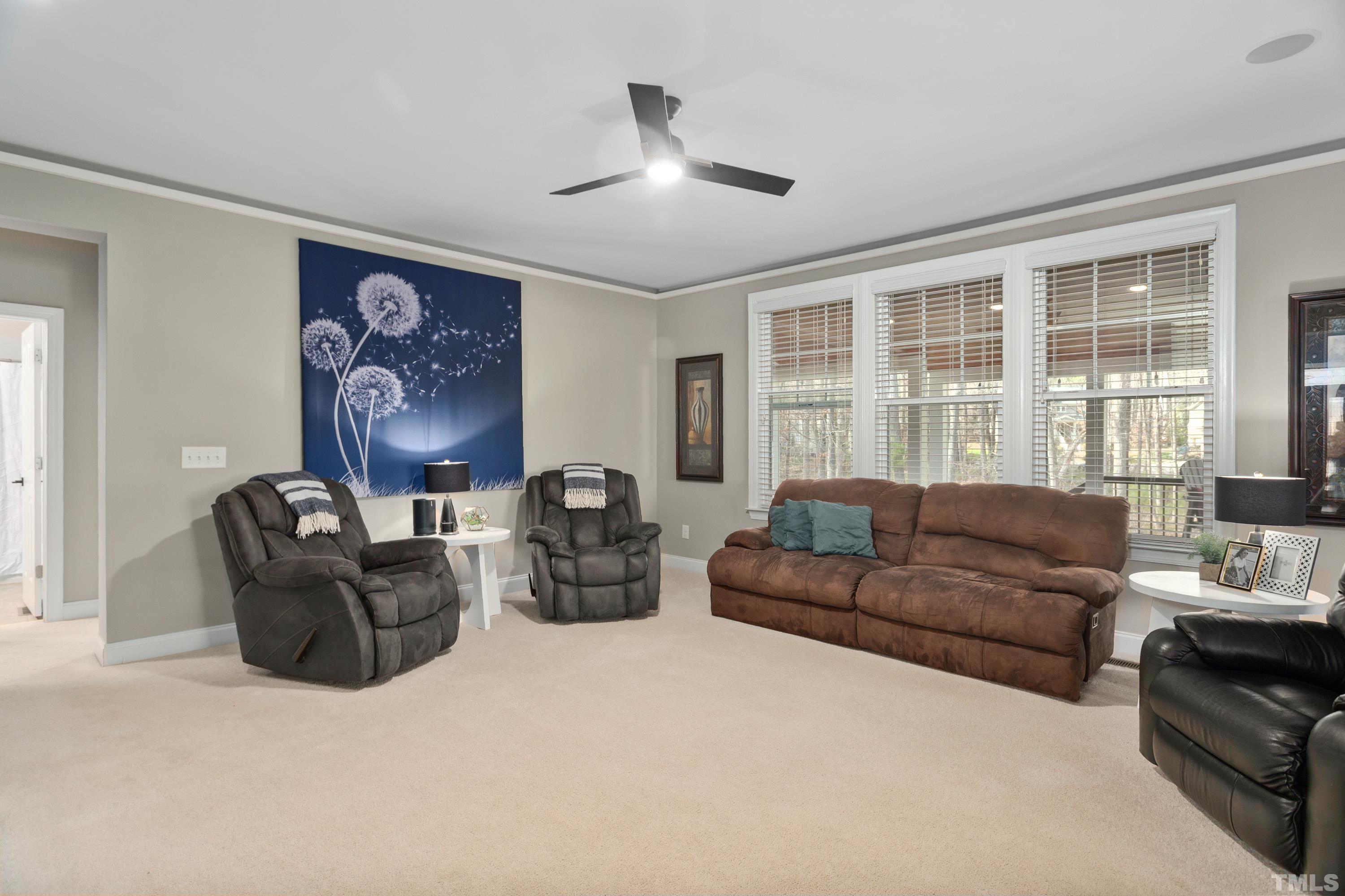 13016 Saxon Way Raleigh, NC 27613 - Photo 39 of 49 a living room with furniture and a large window