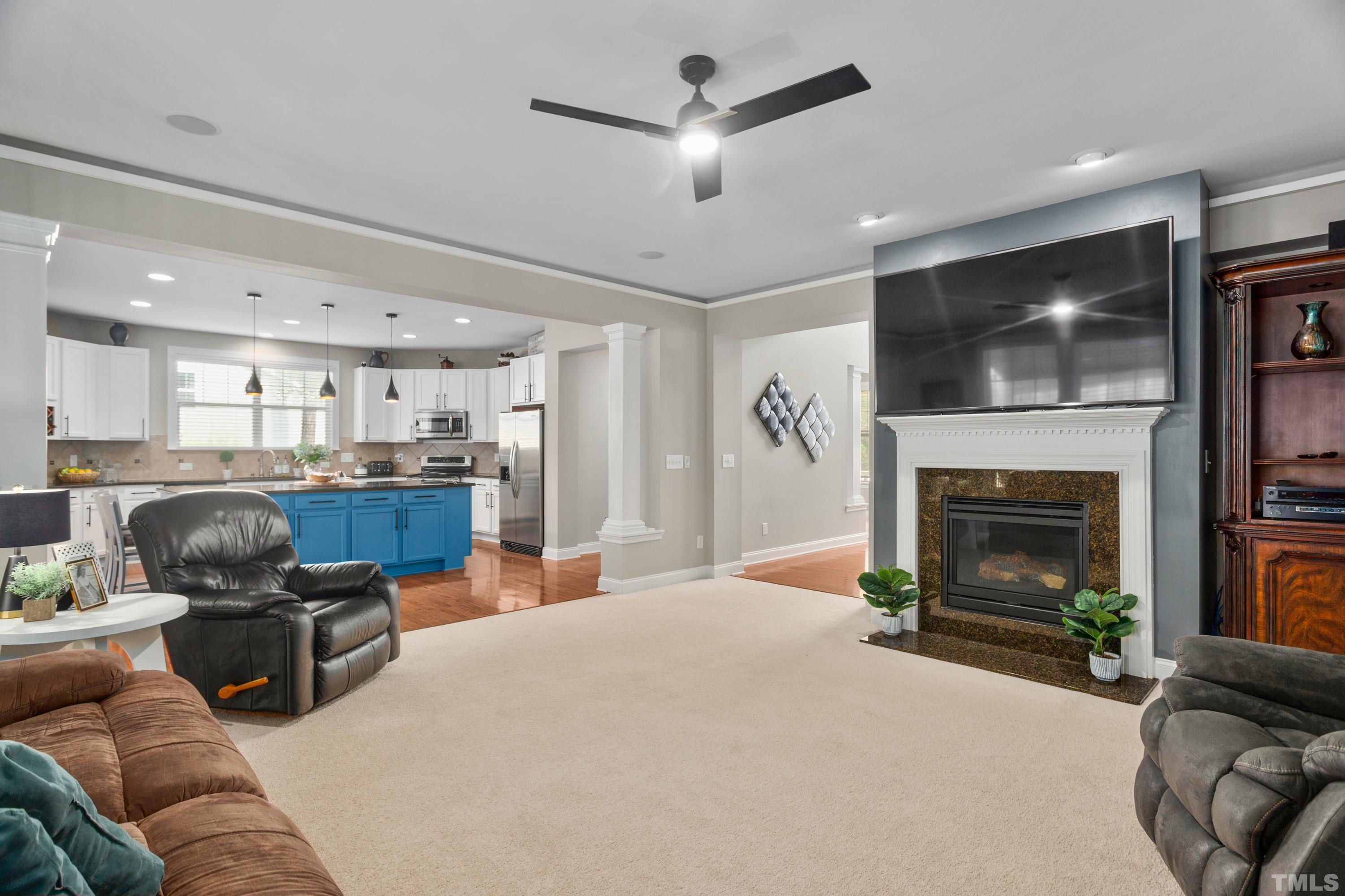 13016 Saxon Way Raleigh, NC 27613 - Photo 40 of 49 a living room with furniture and a fireplace
