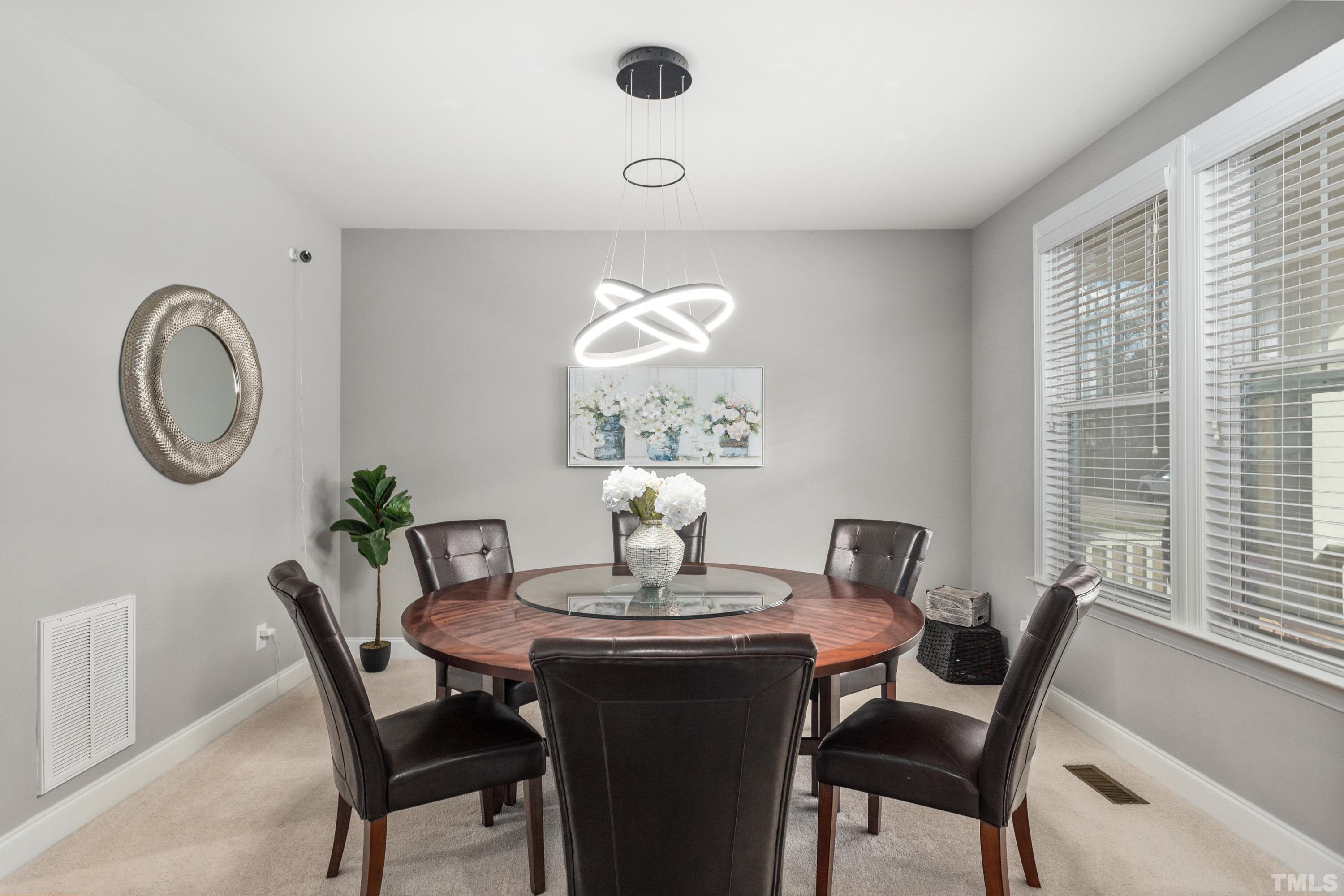 13016 Saxon Way Raleigh, NC 27613 - Photo 49 of 49 a dining room with furniture and window