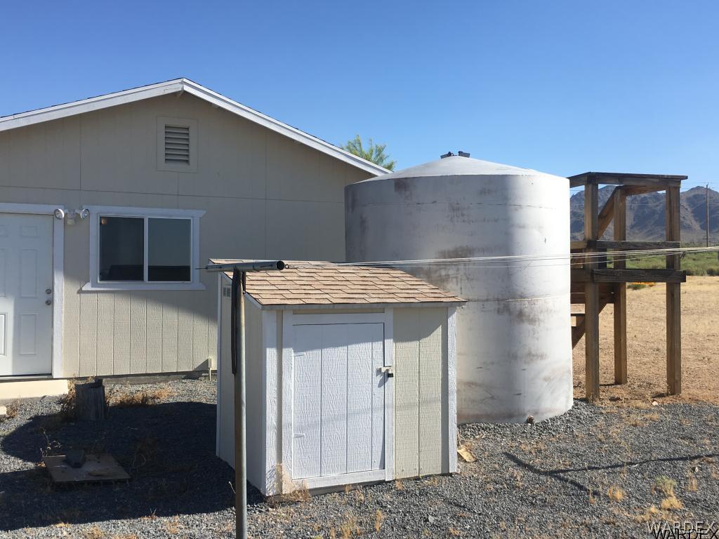 3968 Bacobi Road Golden Valley, AZ 86413 - Photo 4 of 15 Water tank and pump shed