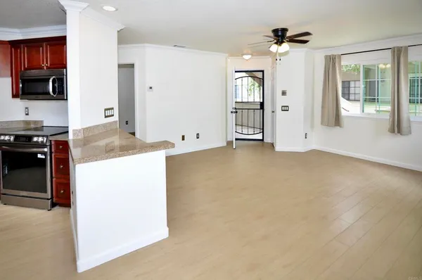 a view of a kitchen cabinets and a stove