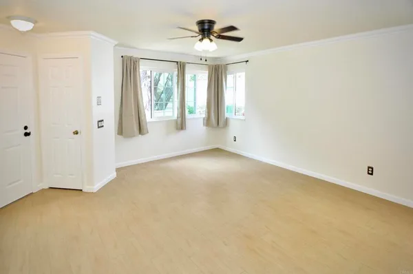 a view of an empty room with a window