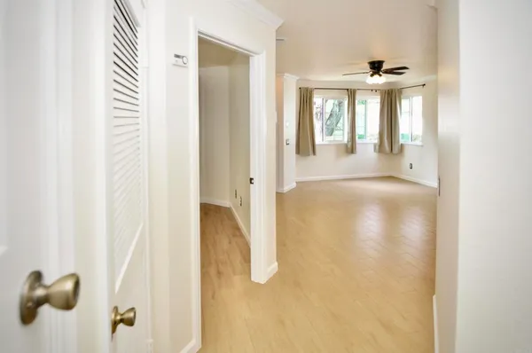 a view of a hallway with windows