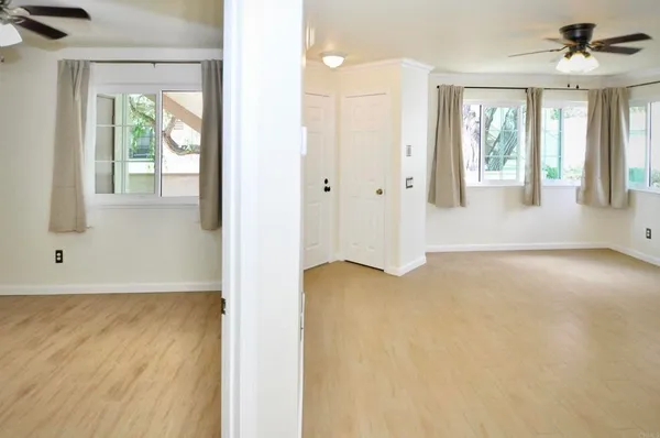 a view of an empty room with a window