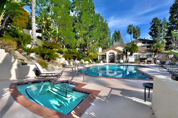 a view of a backyard with sitting area