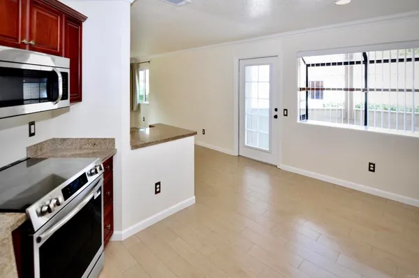 a kitchen with a stove and a microwave
