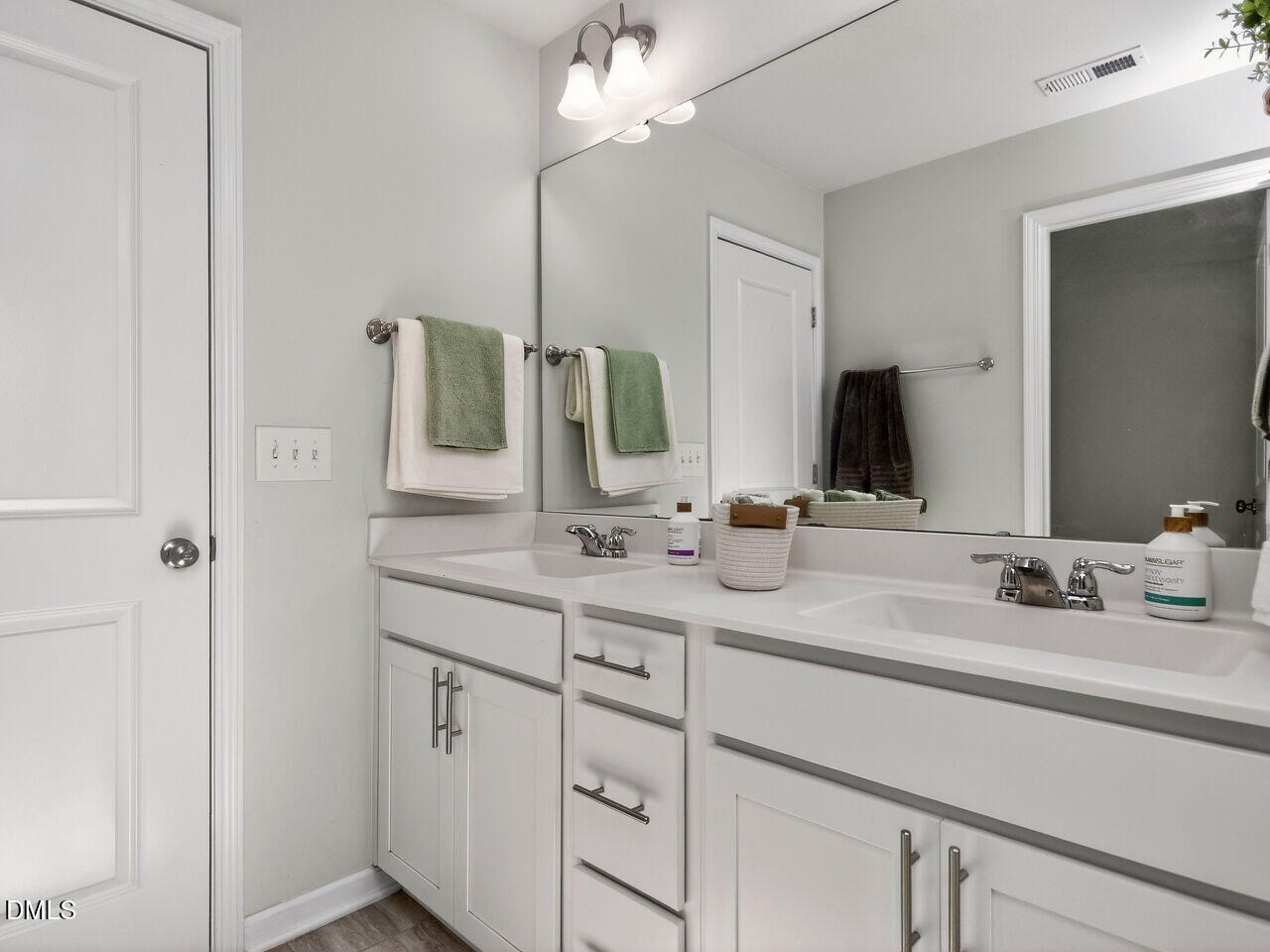 111 Velten Ridge Drive Durham, NC 27713 - Photo 18 of 32 a bathroom with double sink and a mirror