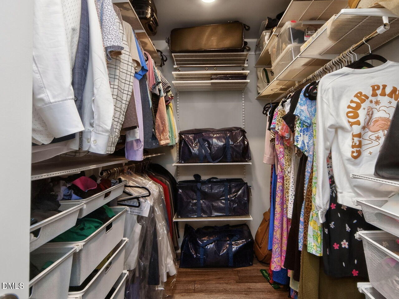 111 Velten Ridge Drive Durham, NC 27713 - Photo 20 of 32 a view of walk in closet with clothes and shoes
