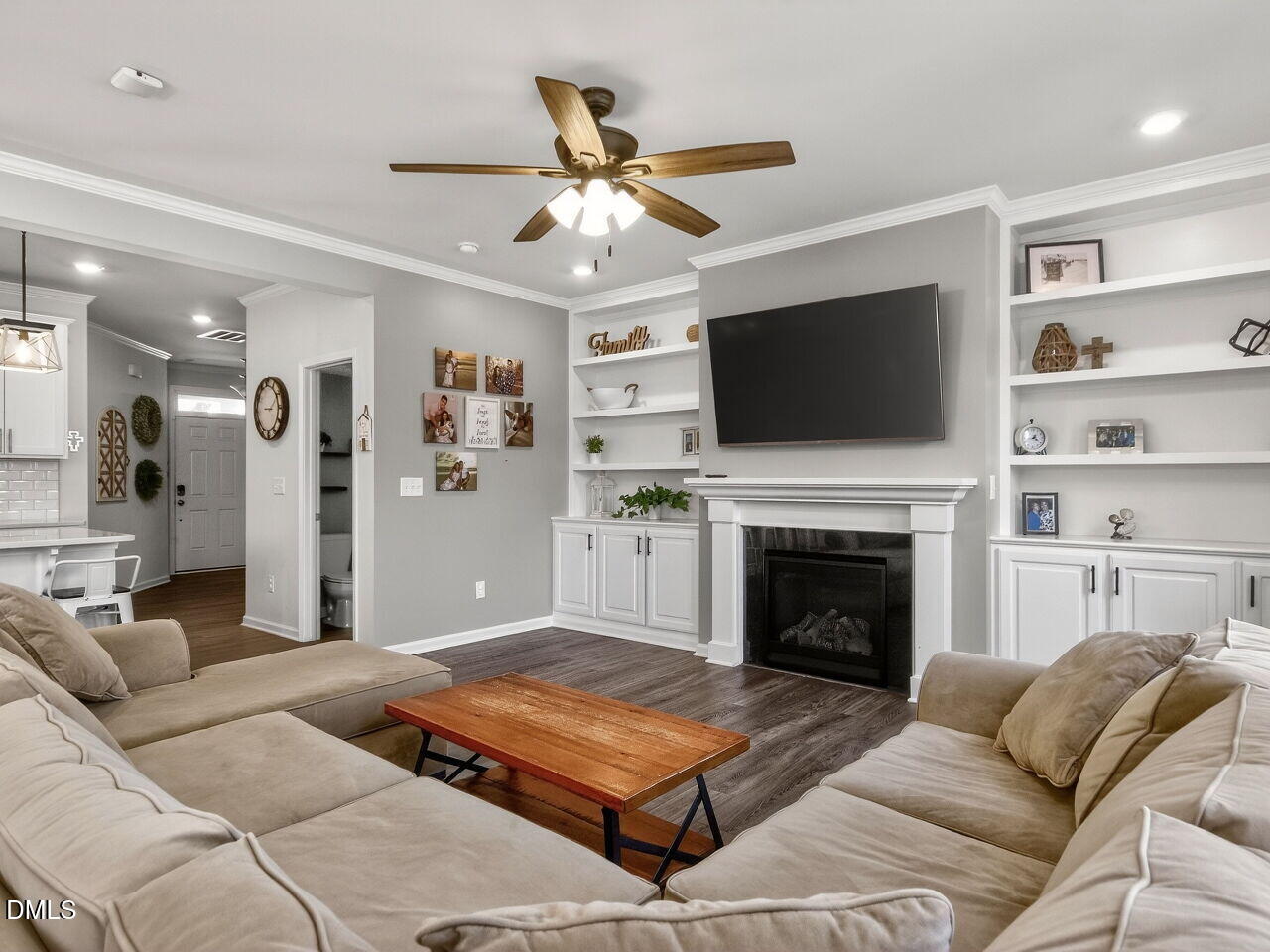 111 Velten Ridge Drive Durham, NC 27713 - Photo 6 of 32 a living room with furniture a flat screen tv and a fireplace