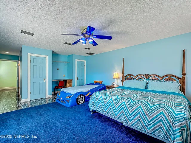 a kitchen with a sink and chairs