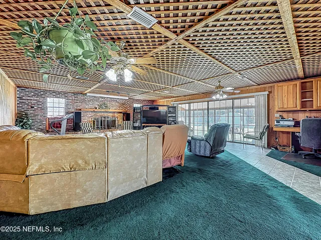 a large kitchen with stainless steel appliances granite countertop a stove and a sink