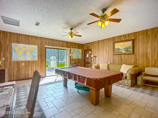 a view of a entryway door with living room