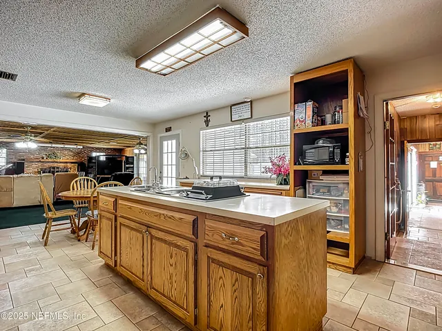 a front view of a house with yard swimming pool and outdoor seating
