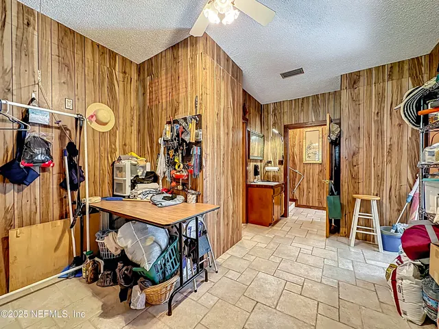 an aerial view of a house with swimming pool garden and patio