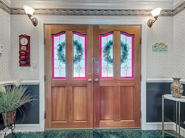 a wooden bench sitting in backside of a house