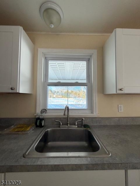 113 D North Shore Point Montague, NJ 07827 - Photo 6 of 18 a kitchen with a sink and cabinets