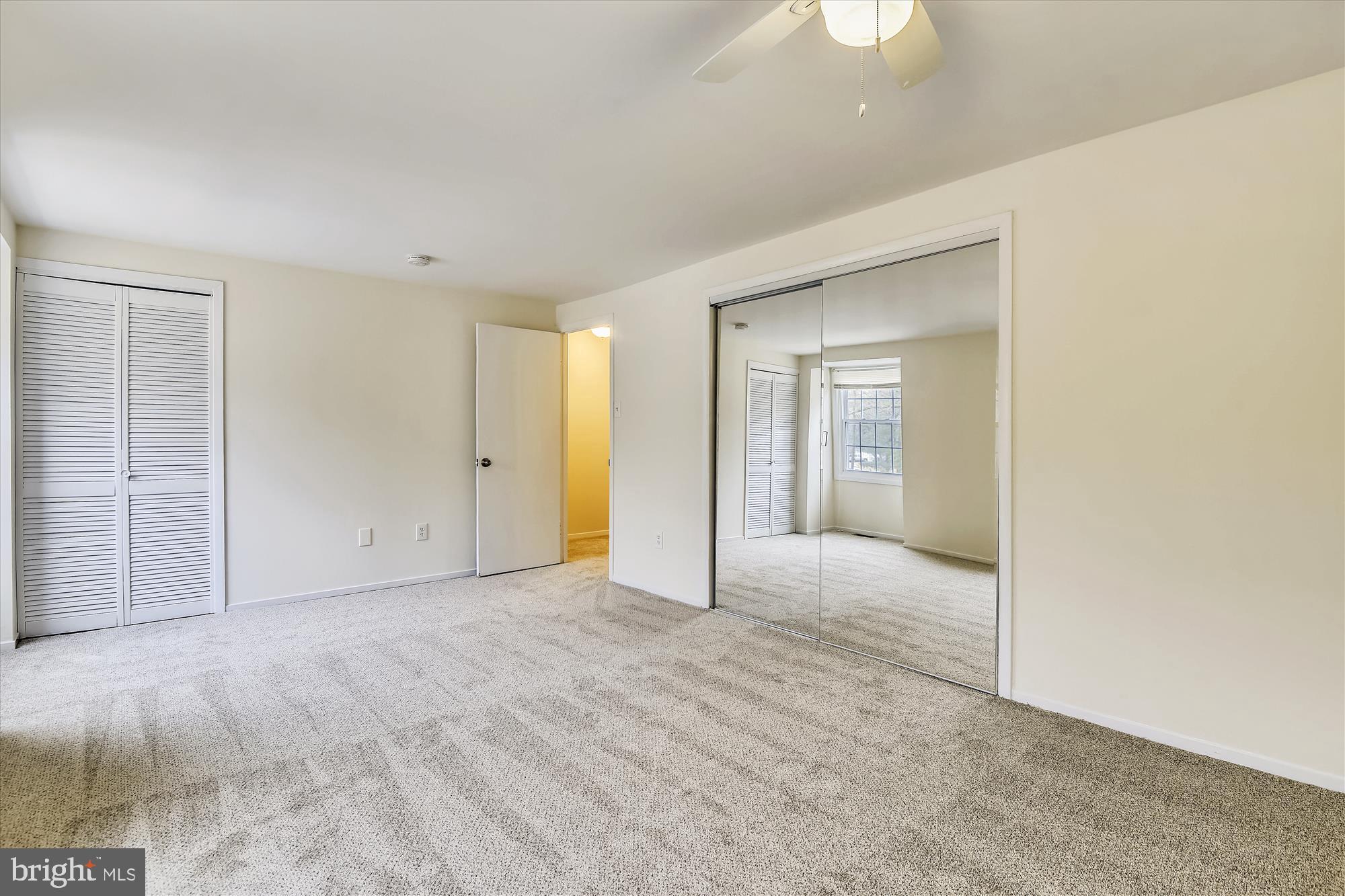 1752 Whitfield Court Crofton, MD 21114 - Photo 12 of 30 a view of an empty room with a ceiling fan