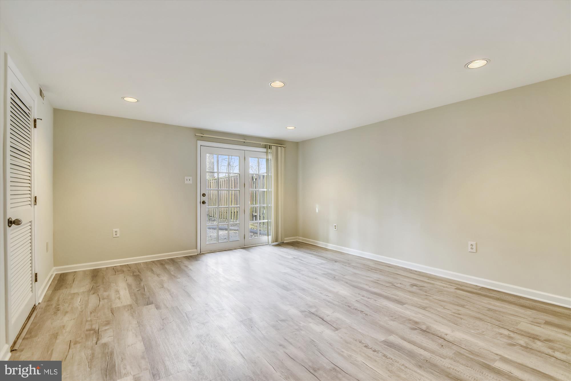 1752 Whitfield Court Crofton, MD 21114 - Photo 16 of 30 a view of an empty room with wooden floor