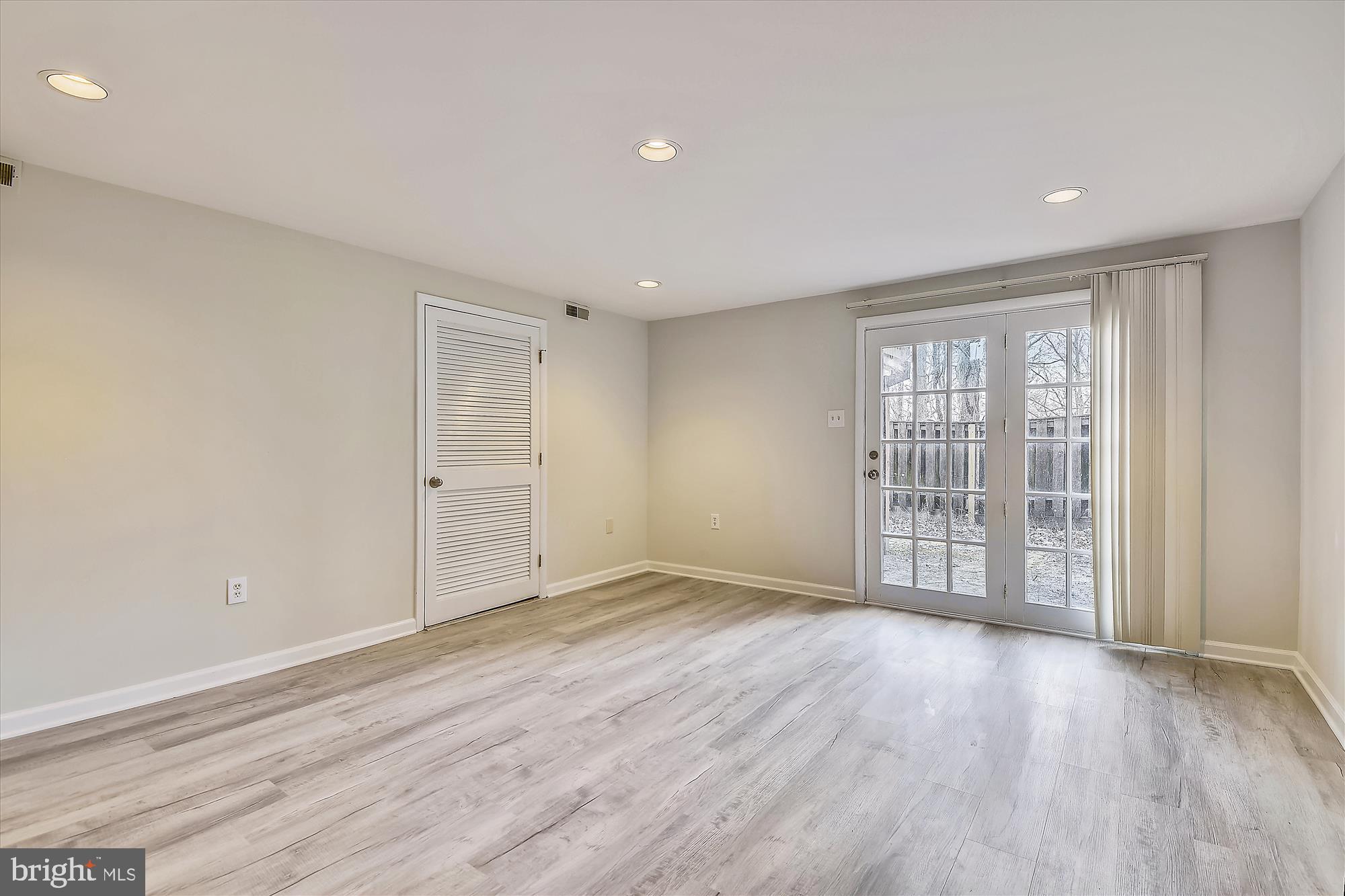 1752 Whitfield Court Crofton, MD 21114 - Photo 17 of 30 wooden floor in an empty room with a window