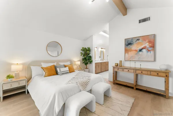 a bed room with a bed and a chandelier