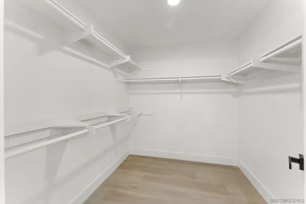 a view of an empty walk in closet