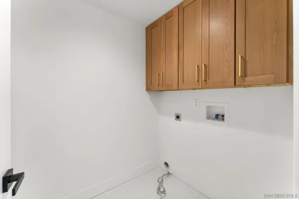 a bathroom with a sink and cabinets