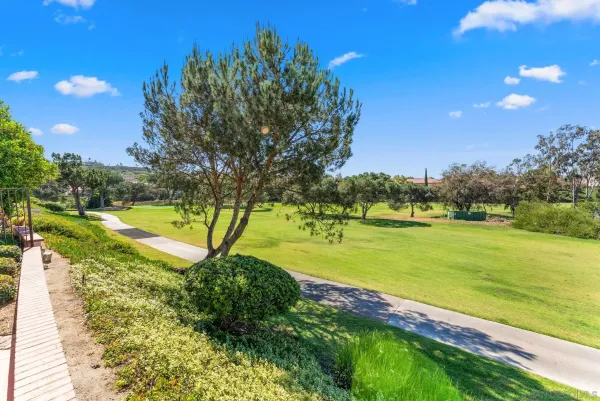 a view of a golf course with a big yard