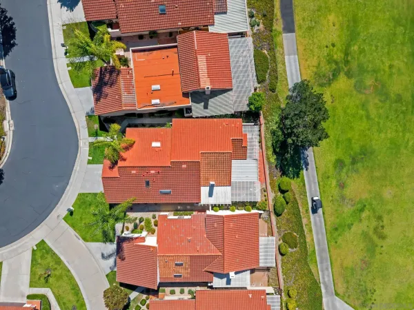 an aerial view of a house with a swimming pool