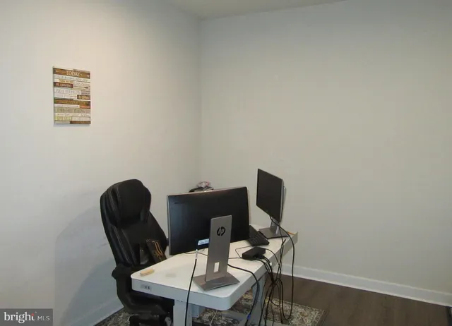 a view of a workspace with furniture