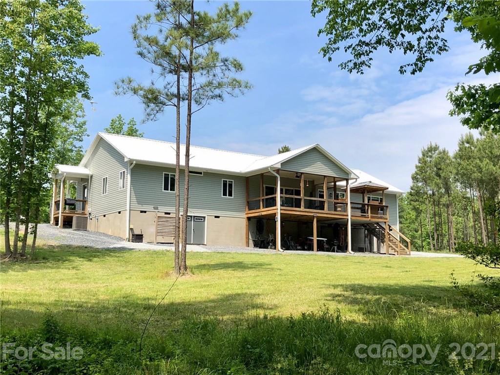 592 Cabin Creek Road Biscoe, NC 27209 - Photo 1 of 20 a front view of a house with a yard