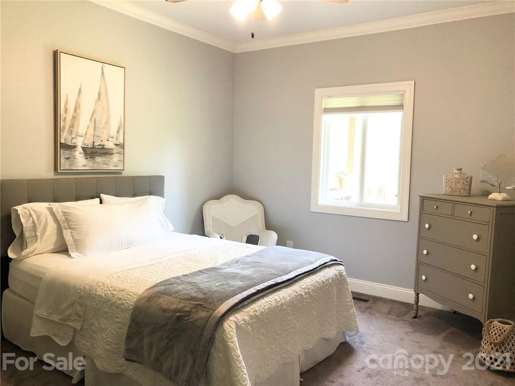 592 Cabin Creek Road Biscoe, NC 27209 - Photo 14 of 20 a bedroom with a bed and a window