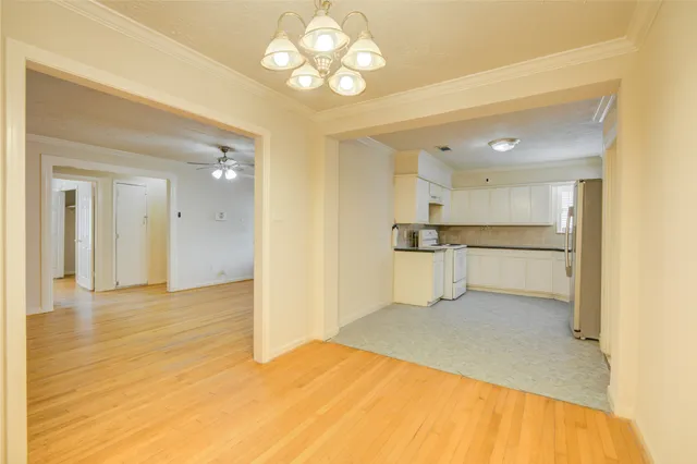 a view of a kitchen with a sink and cabinet