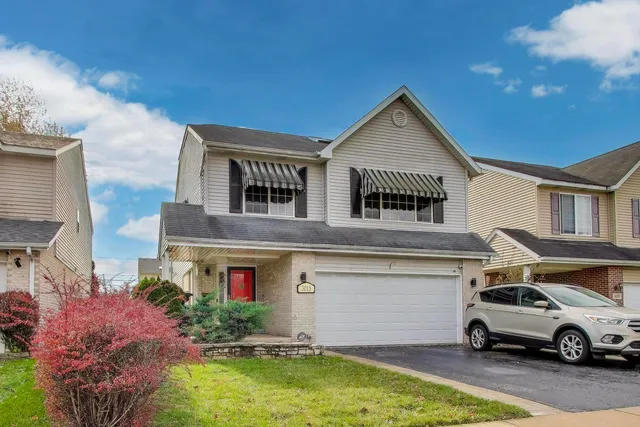 a car parked in front of a house