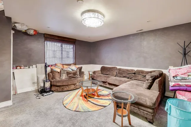 a bedroom with furniture and a chandelier
