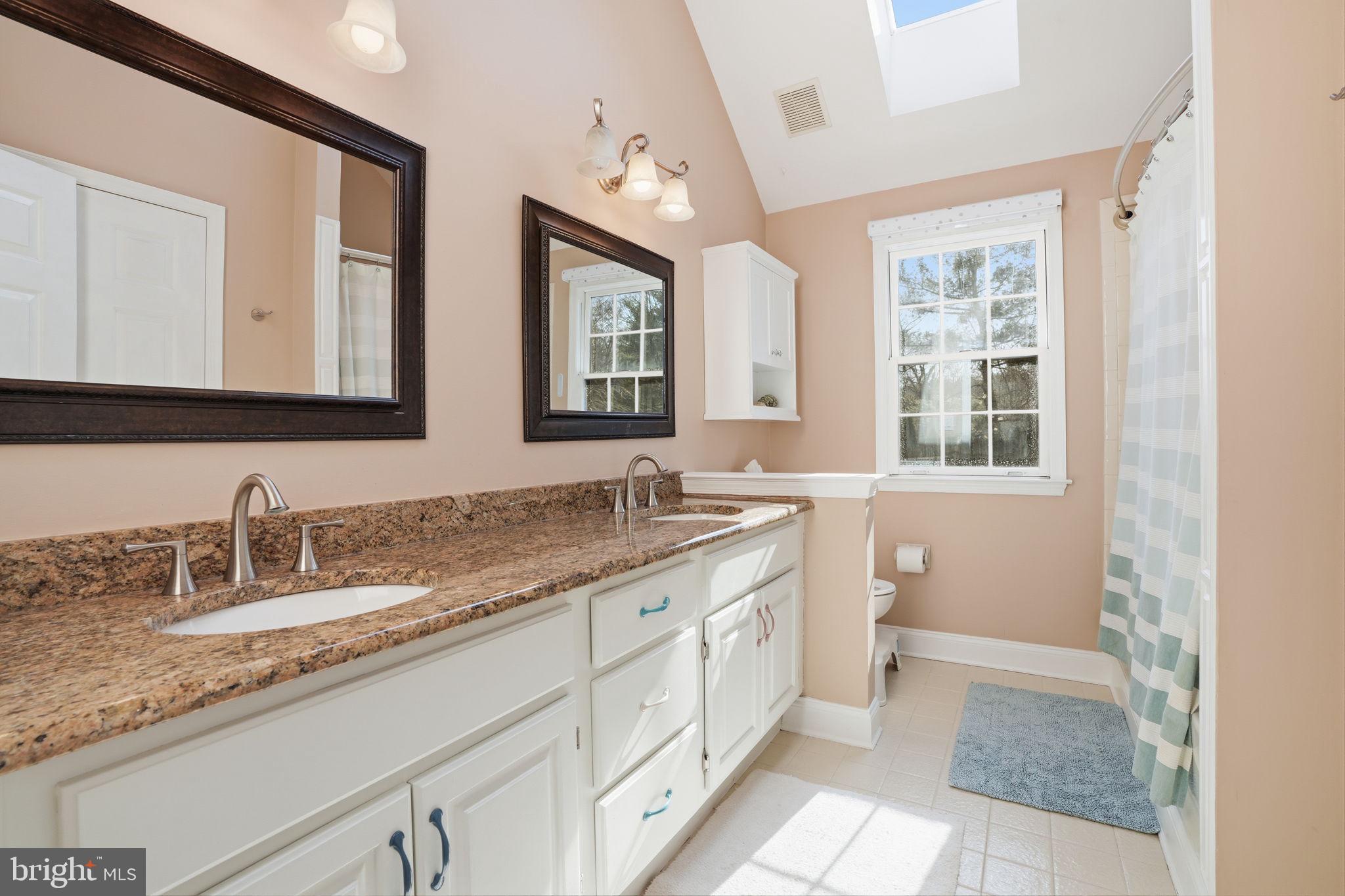 2840 West Fox Chase Circle Doylestown, PA 18902 - Photo 28 of 47 a bathroom with a granite countertop sink mirror and a