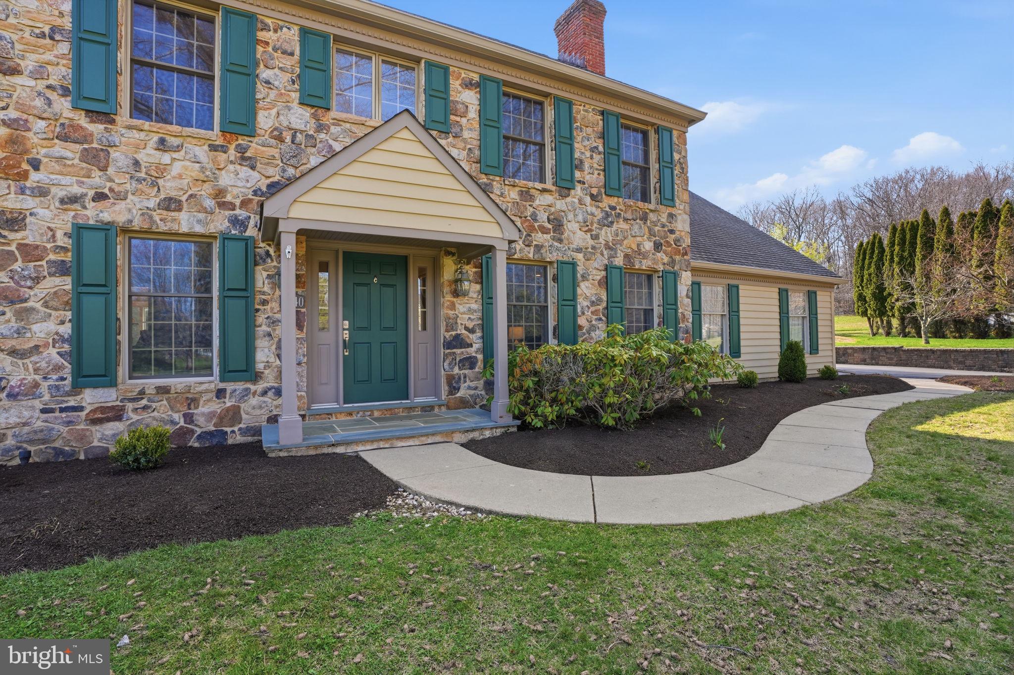 2840 West Fox Chase Circle Doylestown, PA 18902 - Photo 3 of 47 a front view of a house with a yard and potted plants
