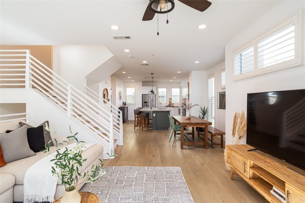 a living room with furniture flat screen tv and a fireplace