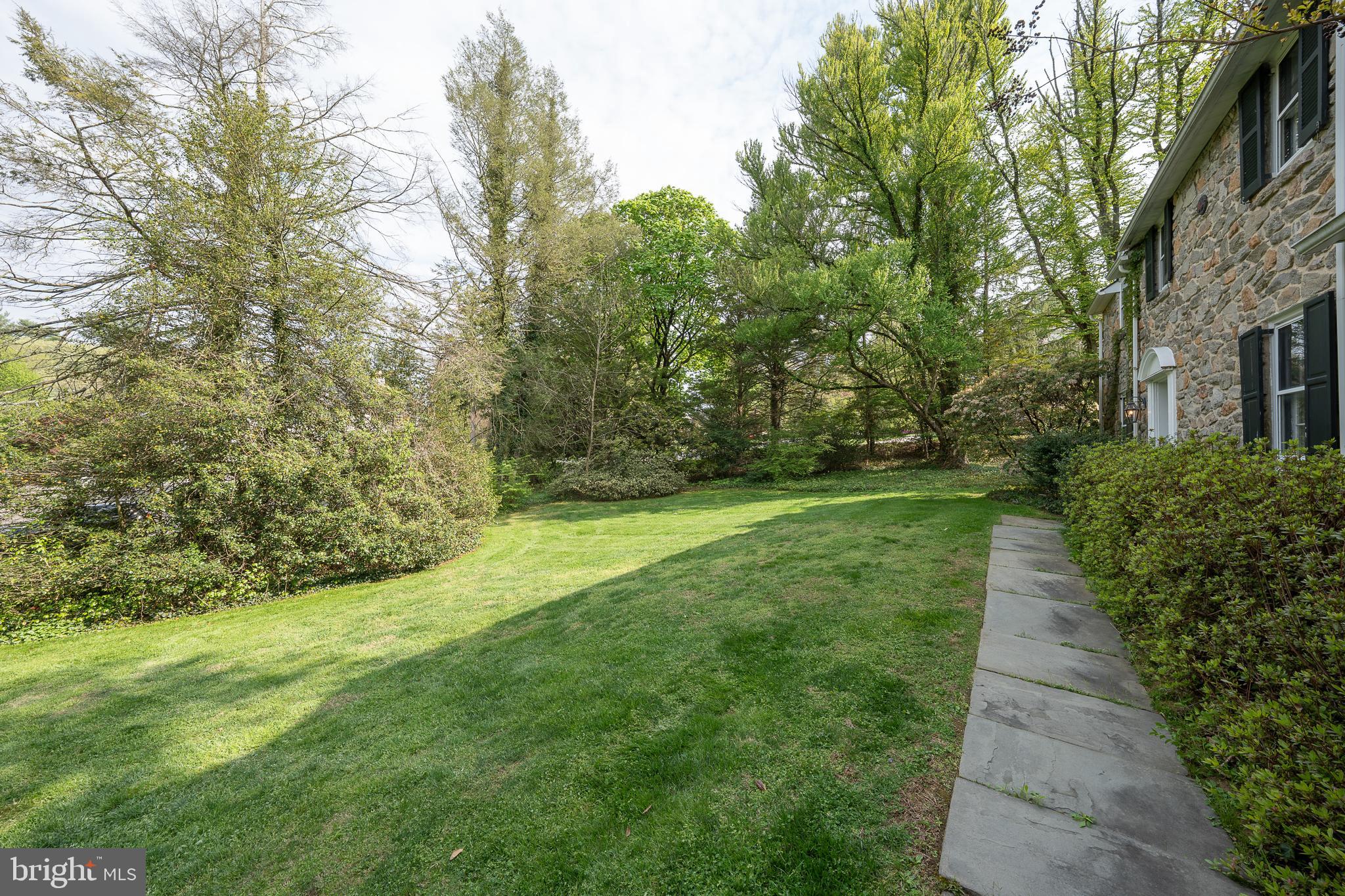 510 Lynmere Road Bryn Mawr, PA 19010 - Photo 37 of 44 a view of a yard with plants and large trees
