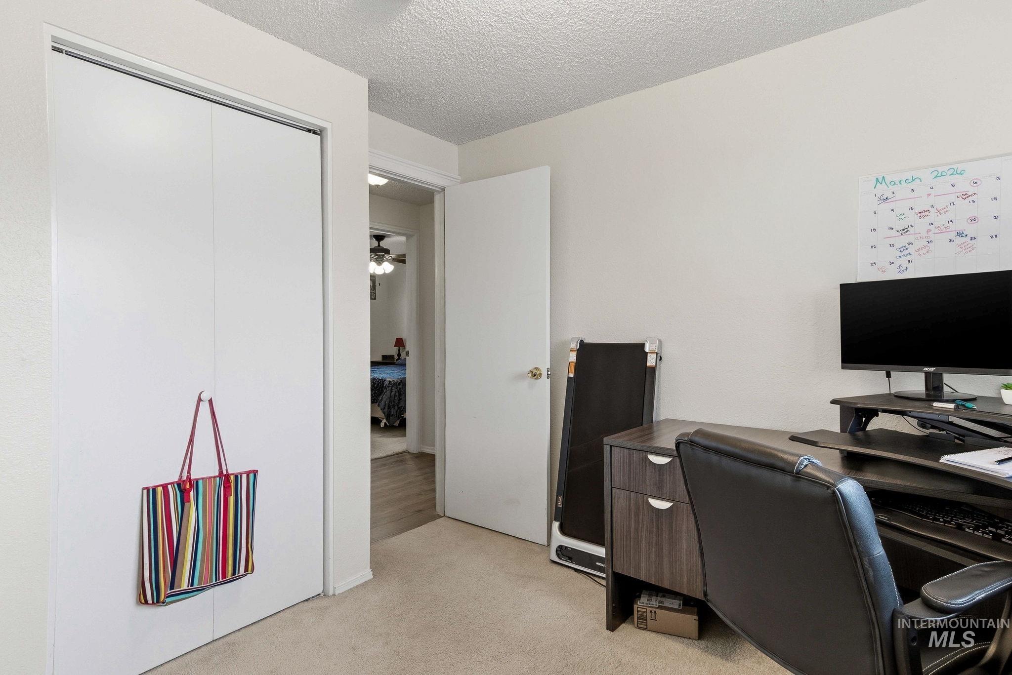 598 Easy Street Kuna, ID 83634 - Photo 19 of 50 Office with light colored carpet and a textured ceiling