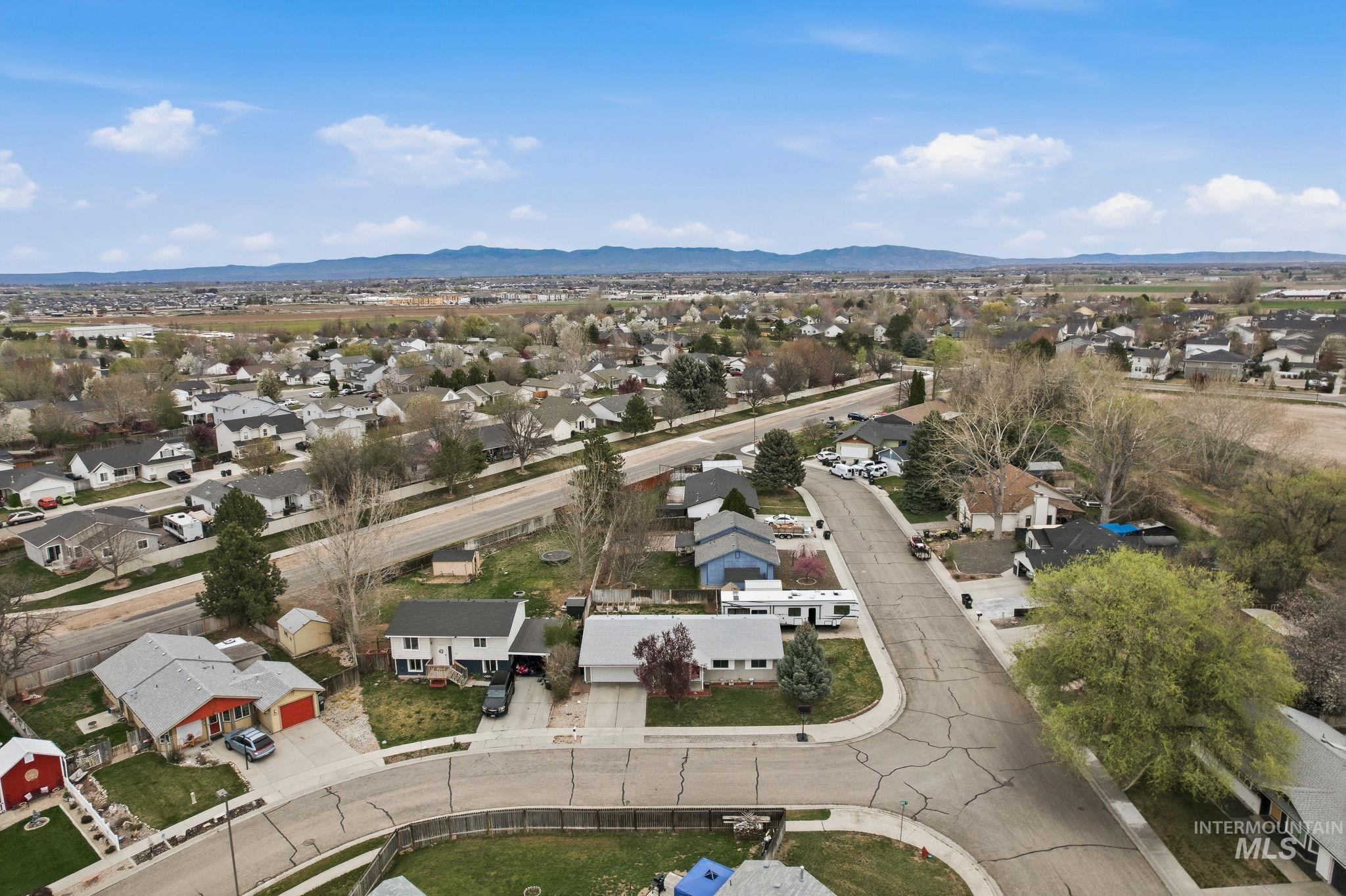 598 Easy Street Kuna, ID 83634 - Photo 46 of 50 Aerial perspective of suburban area with a mountainous background