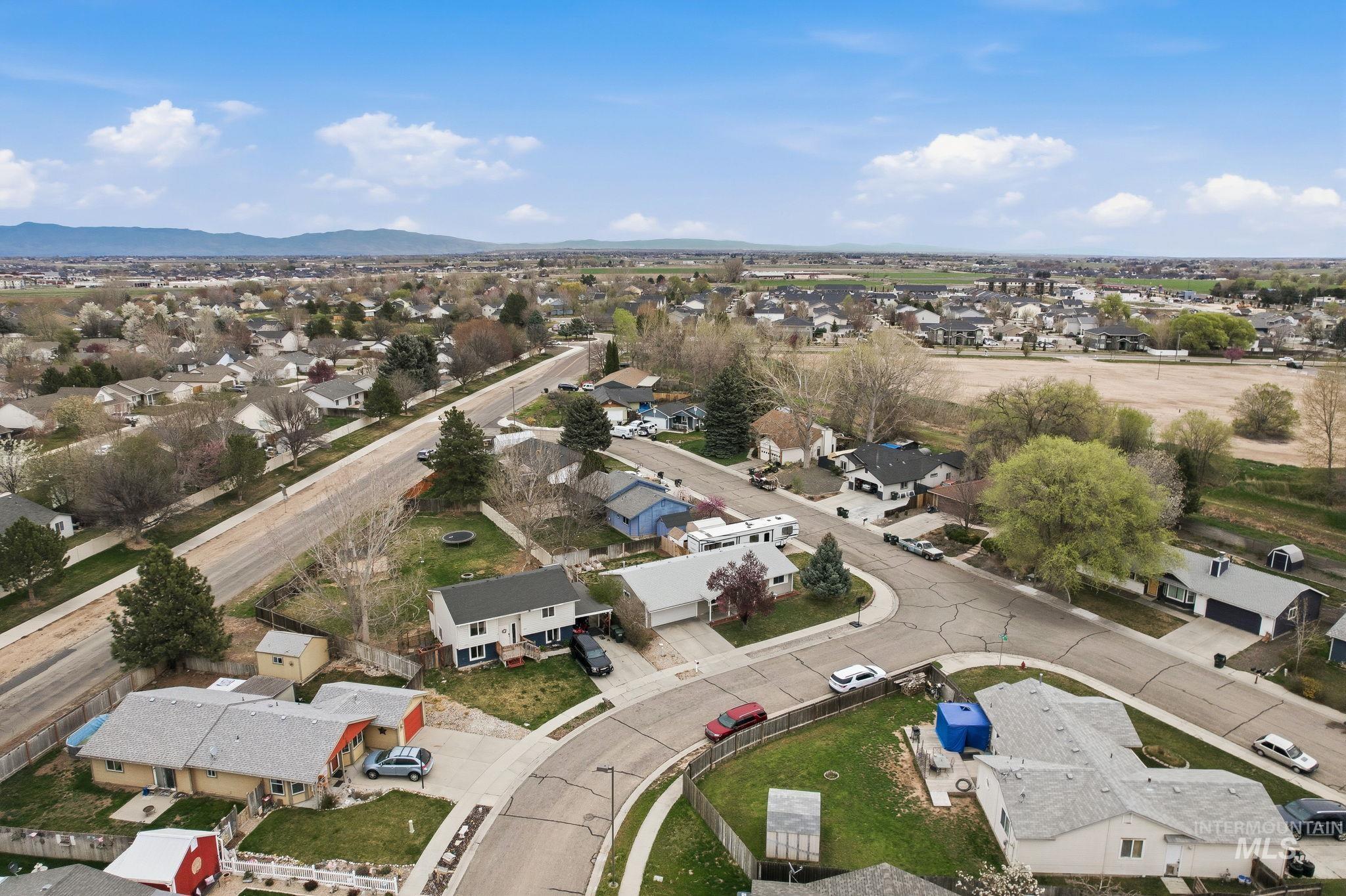 598 Easy Street Kuna, ID 83634 - Photo 47 of 50 Aerial perspective of suburban area with mountains