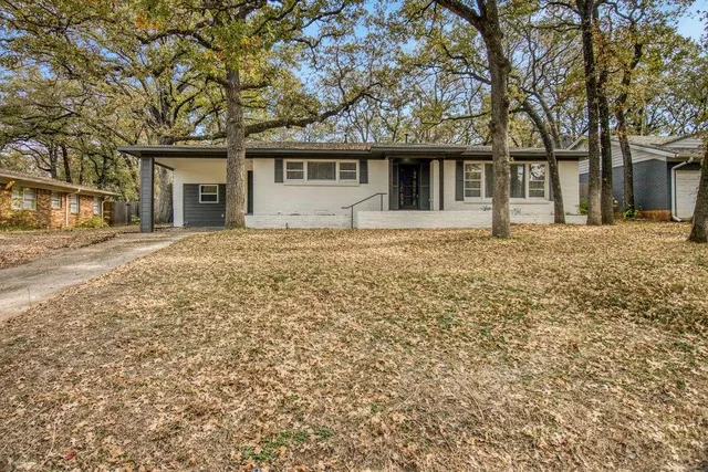 front view of a house with a yard