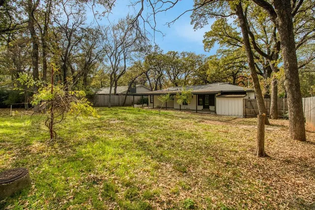 a house with swimming pool in front of it