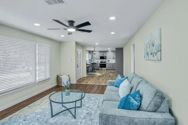 a living room with furniture and a large window