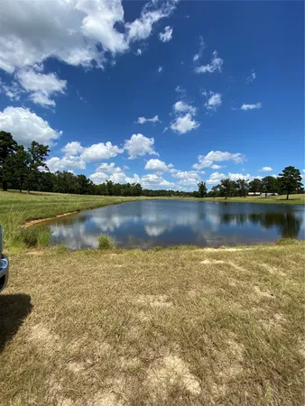 a view of a lake with sunset