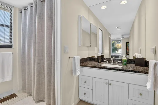 a bedroom with a bed and a chair