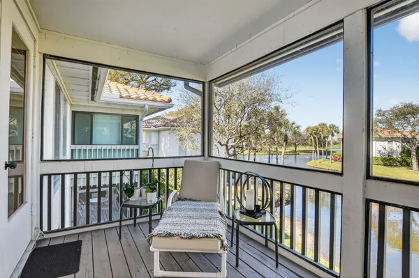 a swimming pool with outdoor seating and yard