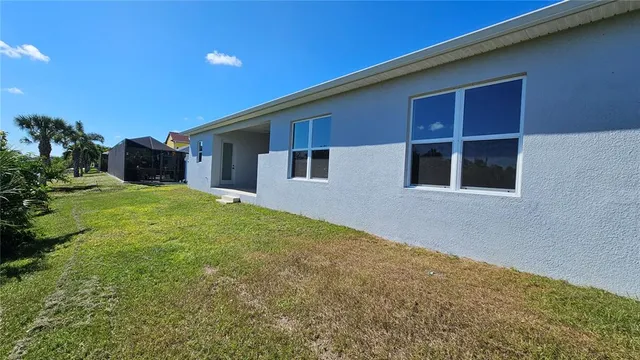 a house view with a backyard space