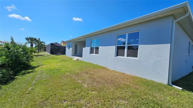 a house view with a backyard space